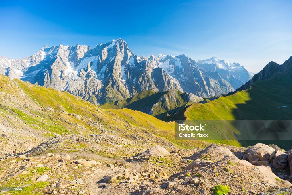 Hih mountain trail with great panoramic view over the Mont Blanc massif. Backpacker's summer adventures and wanderlust in Valle d'Aosta, Italian French Alps.